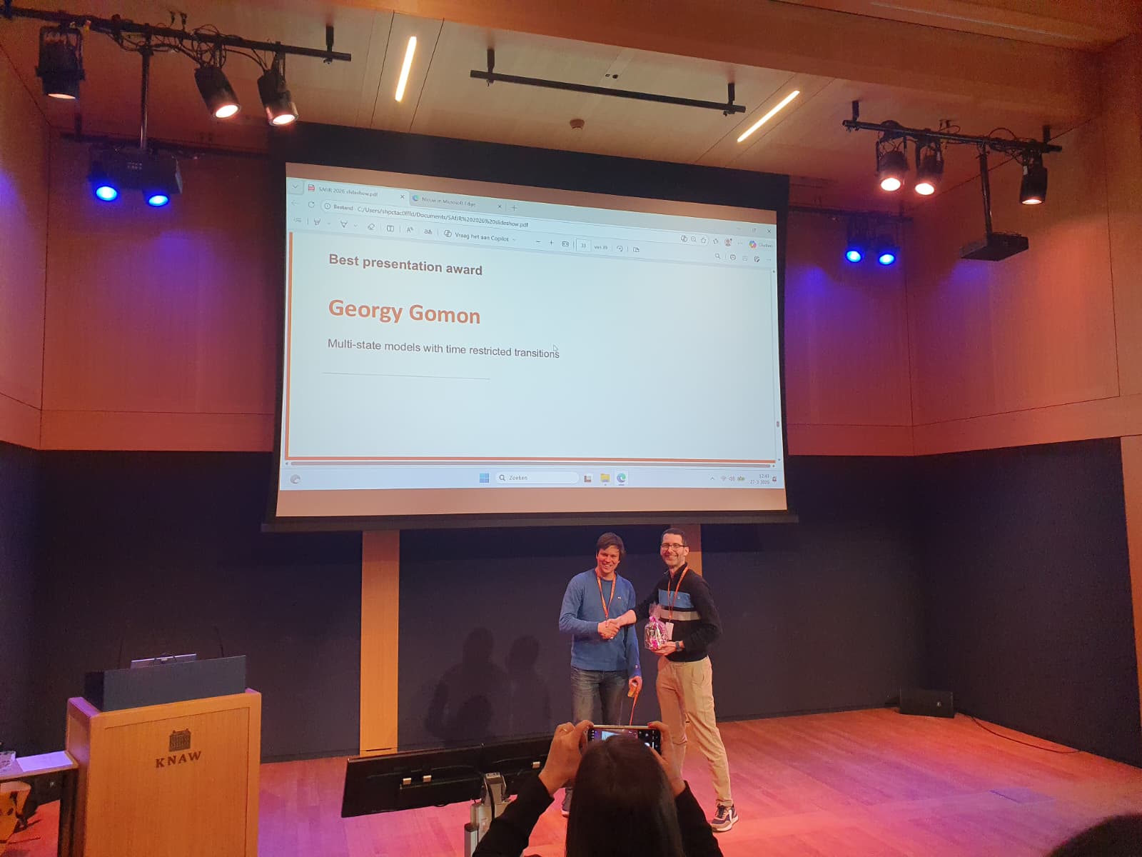Georgy Gomon accepting the SAfJR Best Presentation Award